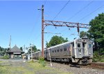 NJT Train # 414, enroute from Gladstone to Hoboken Terminal, departing Murray hill Station and crossing over Foley Place at grade 